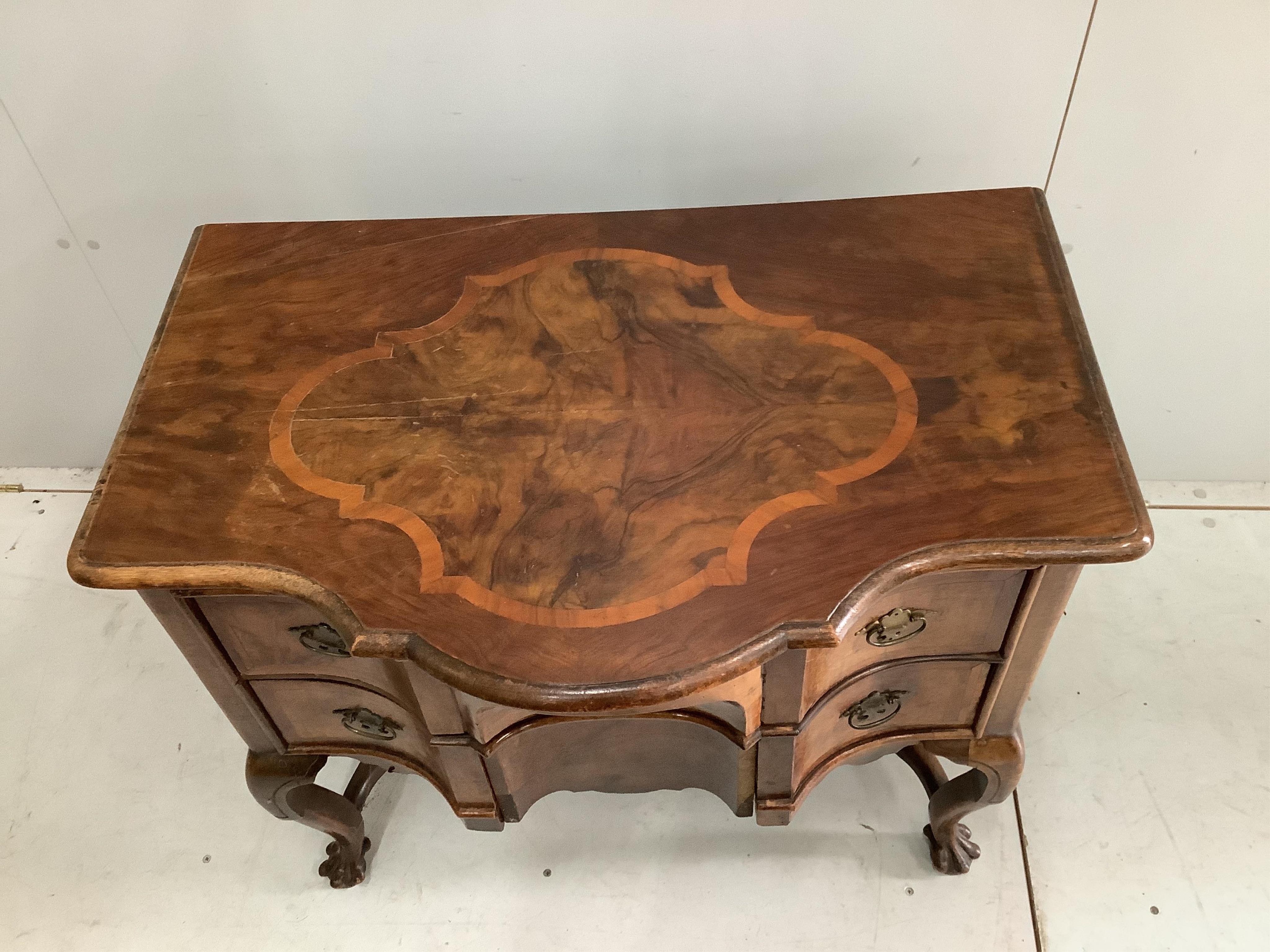 A 19th century Dutch serpentine walnut dressing table with associated triptych mirror, width 83cm. Condition - fair, some losses